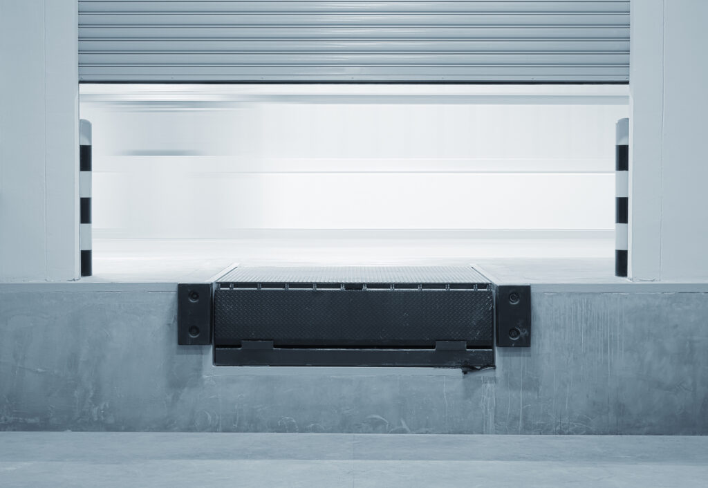 Ramp dock leveller and shutter door of a loading dock.