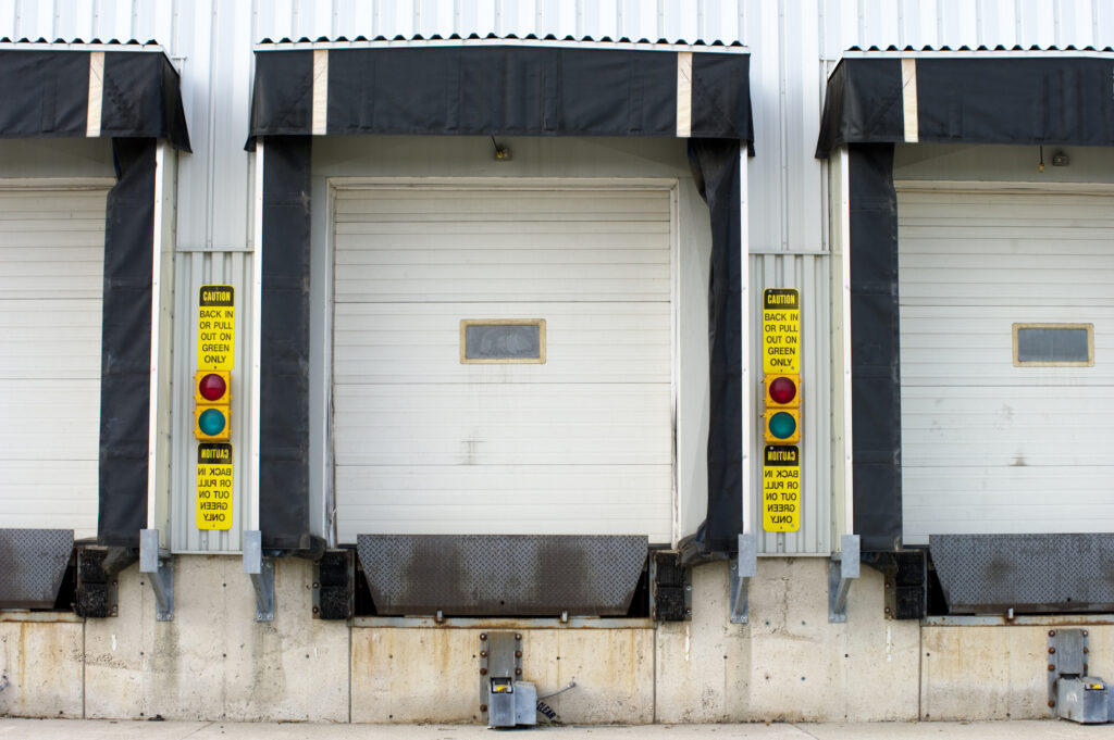A row of empty truck loading docks at a large freight