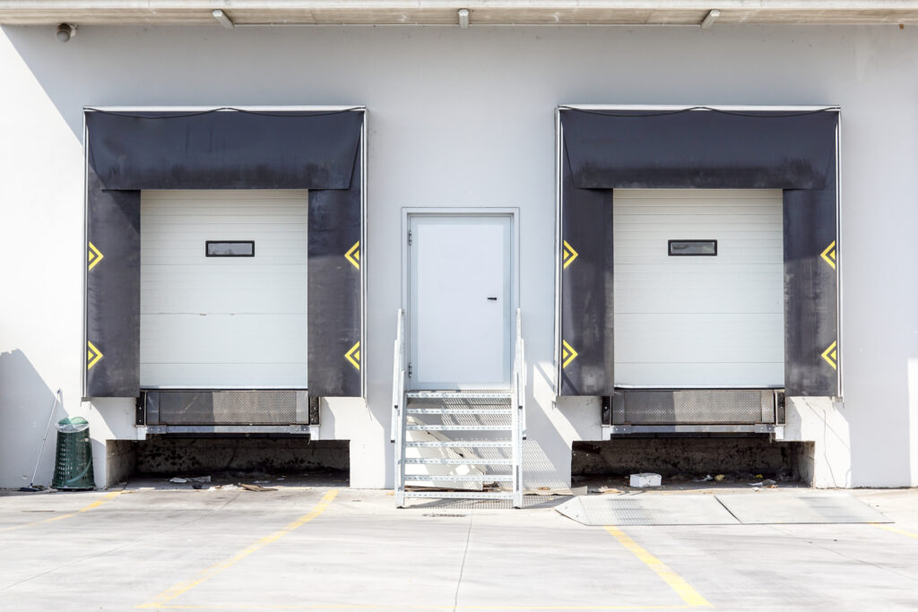 A pair of flush loading docks at an industrial warehouse.